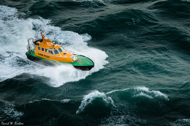 Pilot boat crashing through the waves at Roches Point