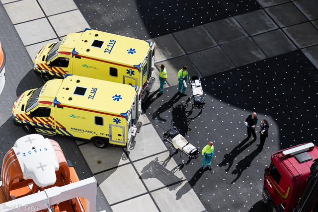 Brightly uniformed ambulance crews preparing to retrieve MORE patients from the ship.